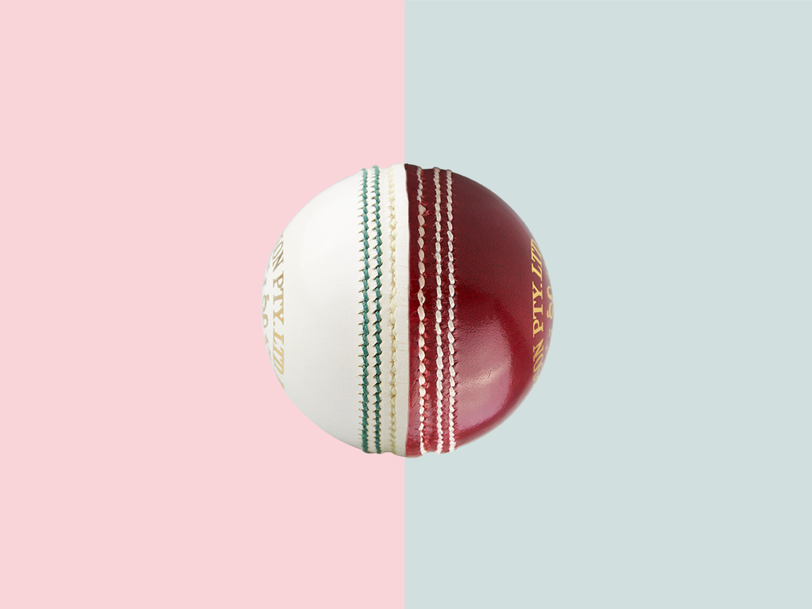 Split cricket ball artwork, half white and half red, on pastel pink and blue background