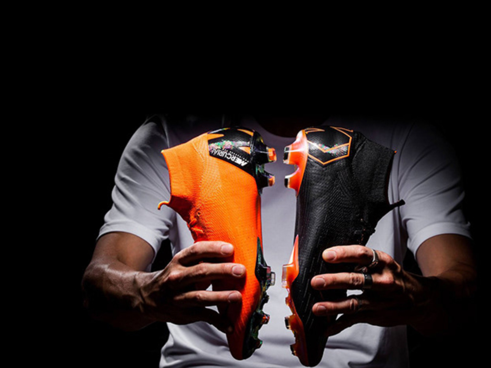 Nike Mercurial football boots product photography in orange and black